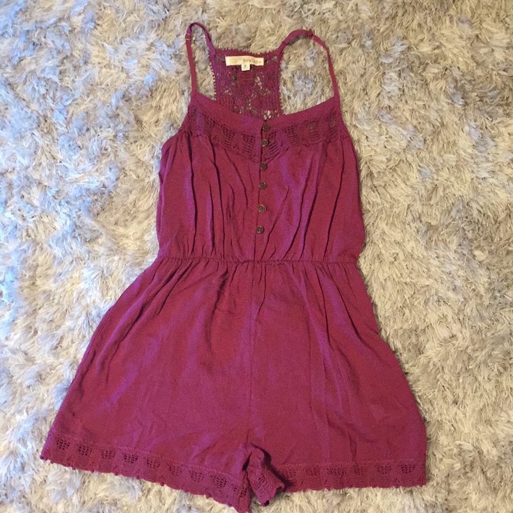 Romper with lace details in a size medium